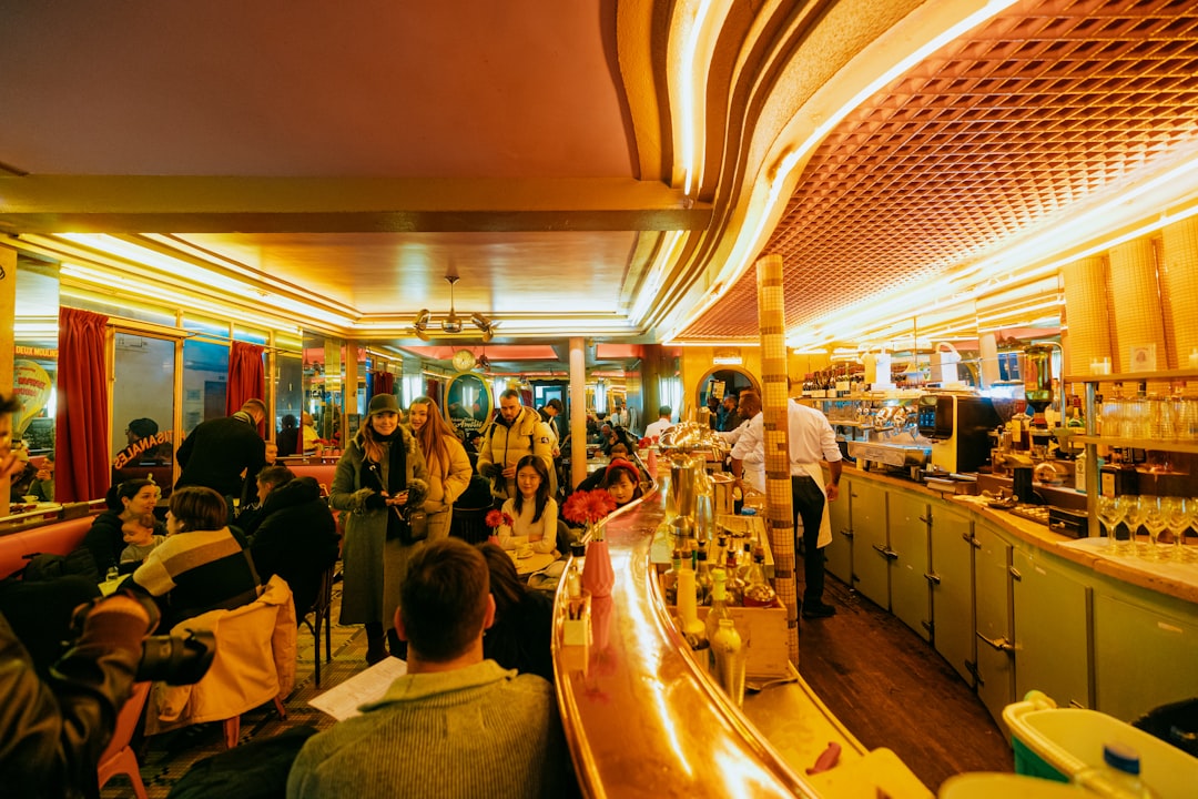 A group of people sitting around a bar